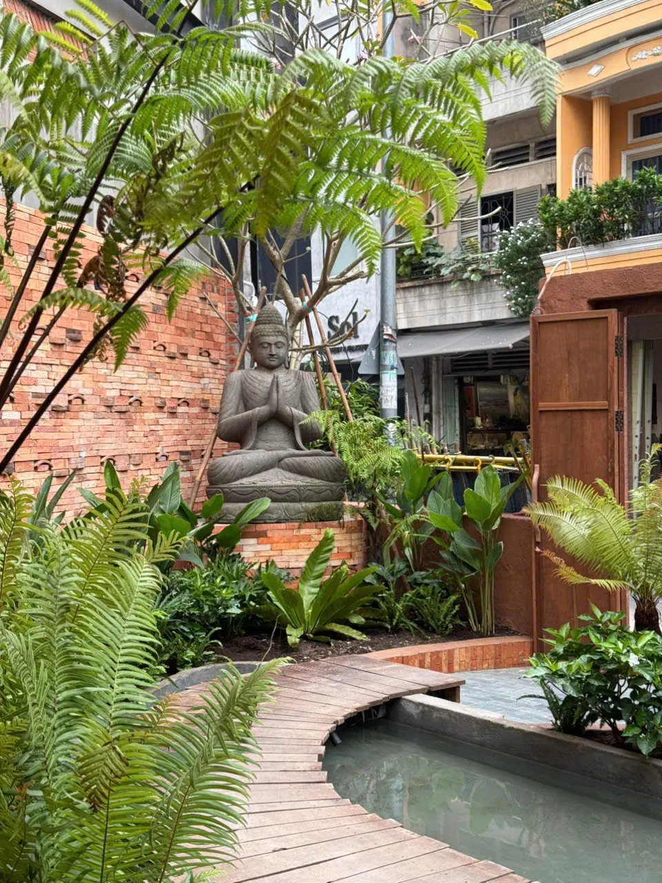 The leafy courtyard and lanterns of Secret Garden