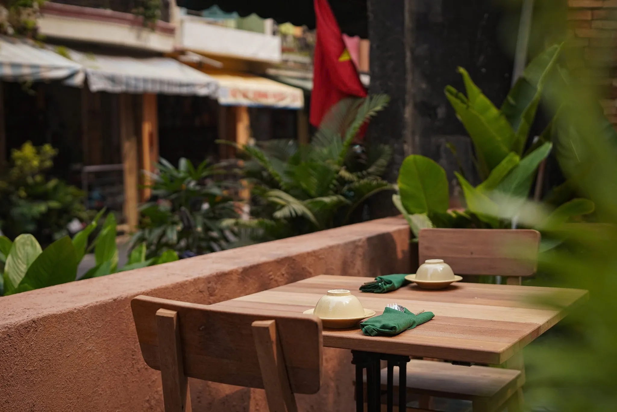 Lantern-lit evening tables in the Secret Garden courtyard